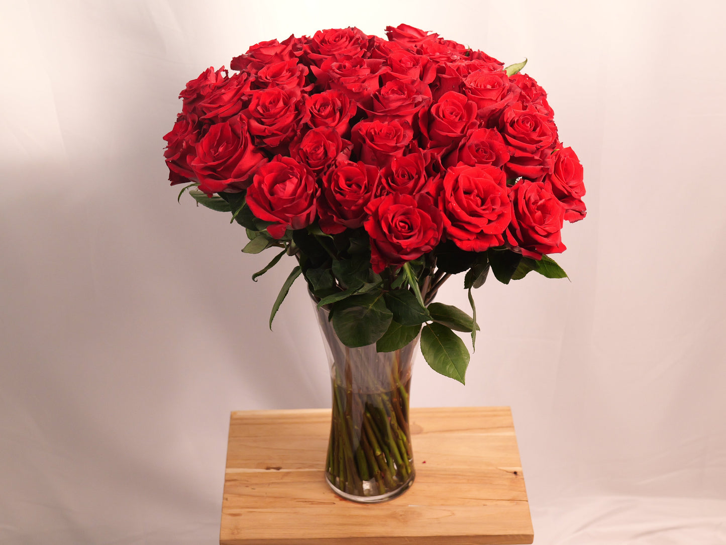 50 Red Roses in Large Glass Vase