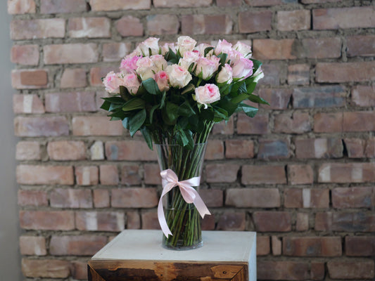 50 Pink Roses in a Glass Vase